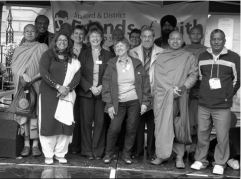Photo of people from different faith goups including Maggie Jeays from Stafford Meeting (centre).