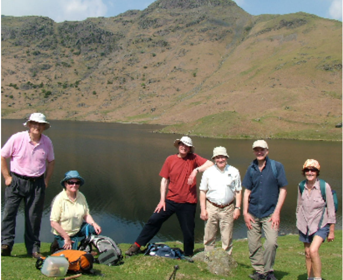 6 Friends pictured at Easedale Tarn with mountains in the background